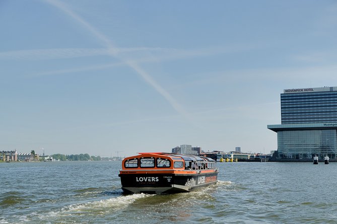 Amsterdam 1h Canal Cruise by Semi-Open Boat with Audio Guide - Singel, Munt Tower, and the old city edge