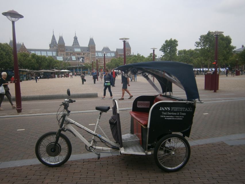 Amsterdam: 2-Hour Sightseeing Tour by Rickshaw - Comfort, weather, and the seat in back