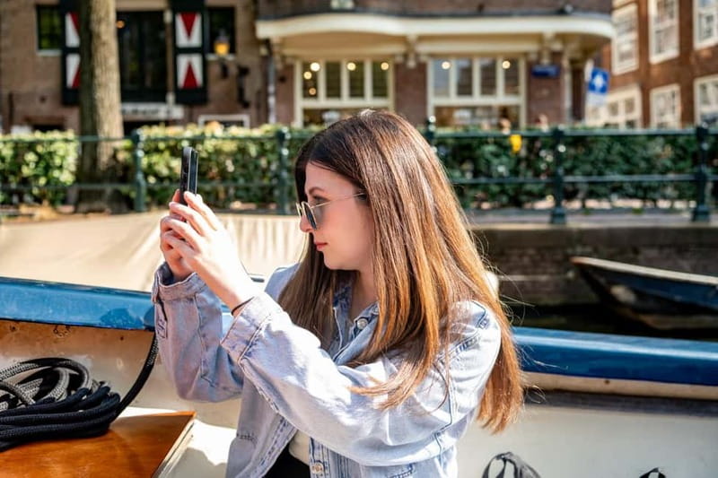 Amsterdam: 75 minute Open Boat Canal Cruise with Live Guide - Weather, timing, and practical details