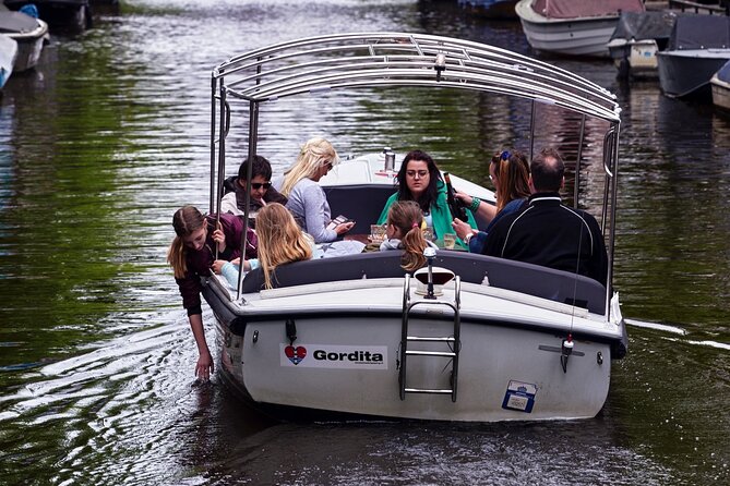 Amsterdam 90-min Private Canal Cruise with Live Guide and Drinks - Dancing Houses and Amsterdam’s playful side
