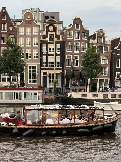 Amsterdam: Boat Tour with Optional Unlimited Drinks - Rembrandt’s House and the curve of the Amstel