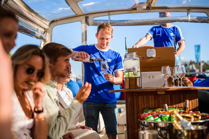 Amsterdam: Canal Booze Cruise with Unlimited Drinks Option - Through De Wallen and the Red Light District