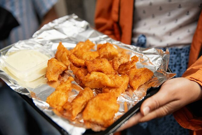 Amsterdam Canal Cruise and local Food Tour - A canal cruise with a Dutch snack in hand