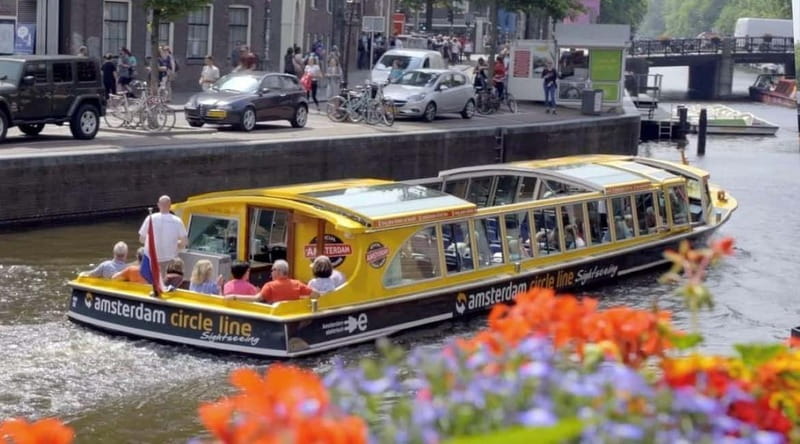 Amsterdam: Canal Cruise from Anne Frank Museum - A covered boat with a useful outdoor deck