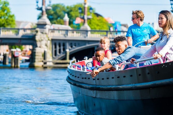 Amsterdam Canal Cruise in Open Boat with Unlimited Drinks Option - Cold weather, rain, and comfort
