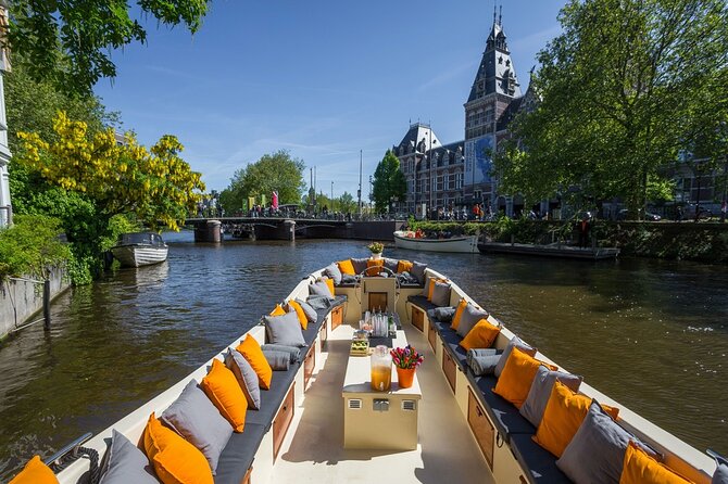 Amsterdam Canal Cruise with German Guide and unlimited drinks - Houseboats, the Magere Brug, and Hermitage