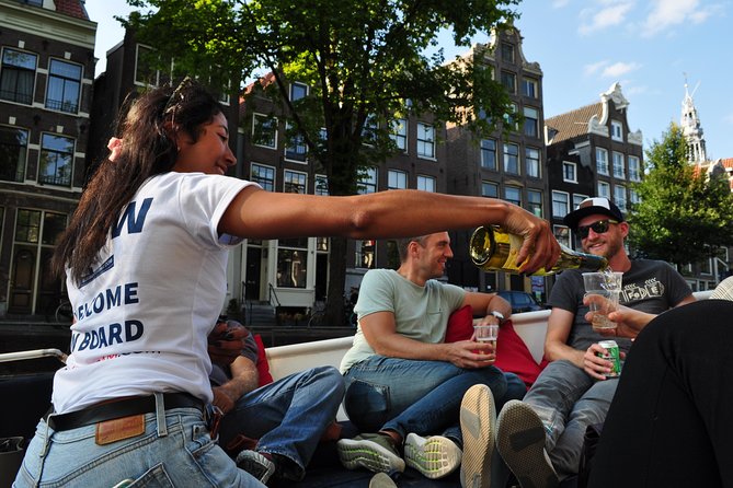 Amsterdam Canal Cruise With Live Guide and Unlimited Drinks - A quiet start along the Amstel