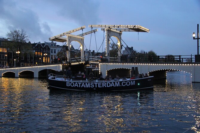 Amsterdam Canal Cruise with Open Bar - Central Station - Drinks, comfort, and the open-boat setup