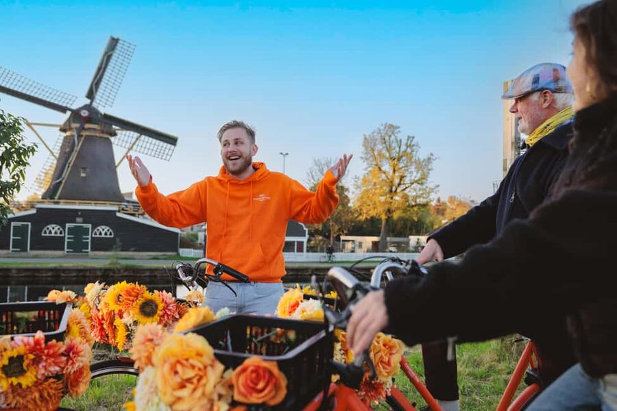 Amsterdam: Cheese, Windmill & Countryside Bike Tour - Leaving Central Amsterdam by ferry