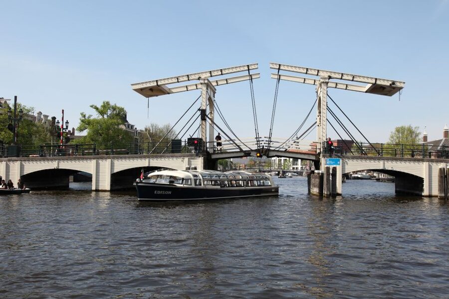 Amsterdam: City Canal Cruise & Straat Museum - Two Amsterdam experiences with very different rhythms