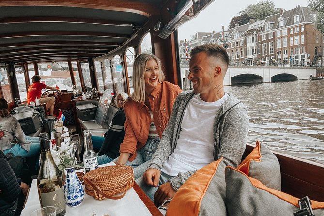 Amsterdam Classic Saloon Boat Cruise with Drinks and Cheese - Guides, commentary, and the sound level