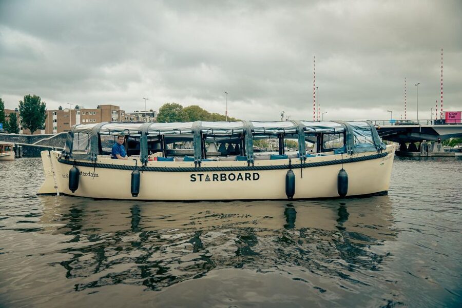 Amsterdam: Covered Canal Booze Cruise with Unlimited Drinks - The host and skipper shape the experience