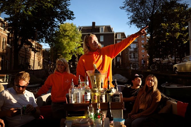 Amsterdam Evening Canal Cruise with Live Guide and Onboard Bar - Cancellation and timing details