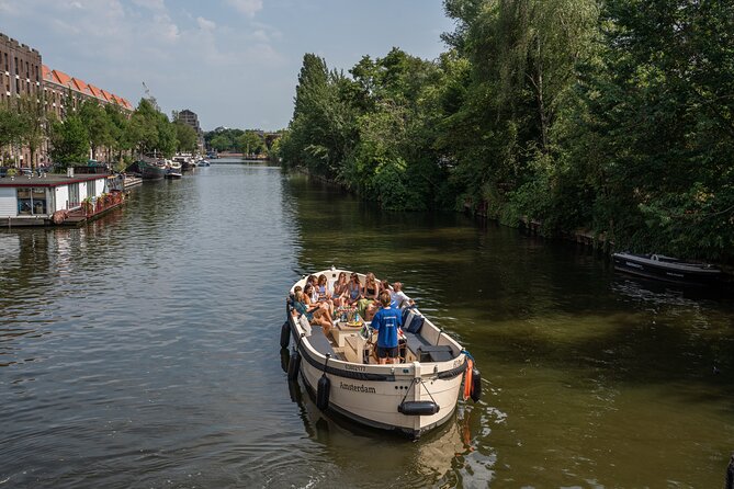 Amsterdam: Evening Candle Light Cruise With Wine & Cheese - Waterlooplein, the Stopera, and Amsterdam’s changing identity