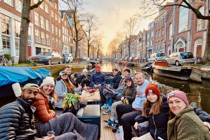 Amsterdam Evening Cruise in Small Group - Blankets, rain cover, and drinks aboard