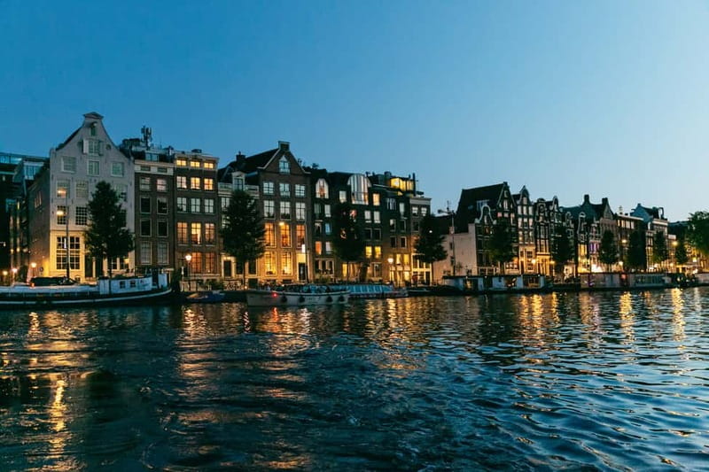 Gable houses along an Amsterdam canal at dusk
