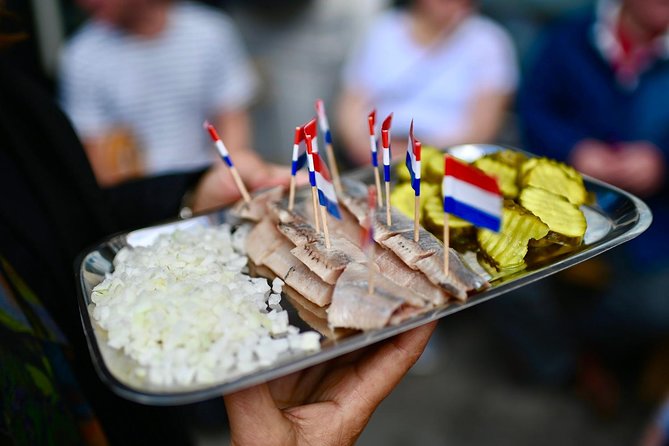 Amsterdam Food Tour of 10+ Local Classic Tastings in Jordaan Area - At the fishmonger: herring and kibbeling