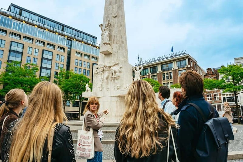 Amsterdam: Guided Cultural Walking Tour - Meeting the guide beneath the National Monument