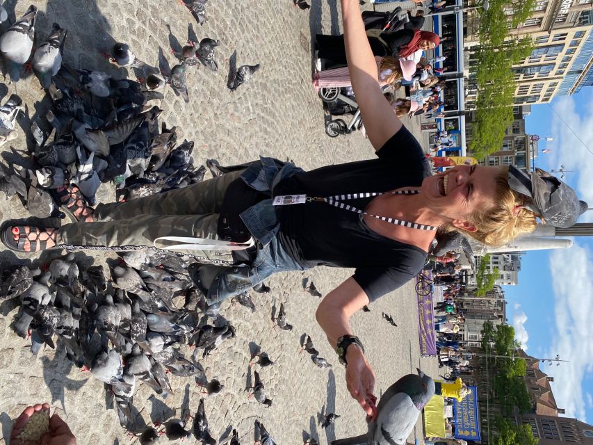 Amsterdam: Guided Off-The-Beaten-Track Walking Tour - Dam Square and the symbols of Dutch power
