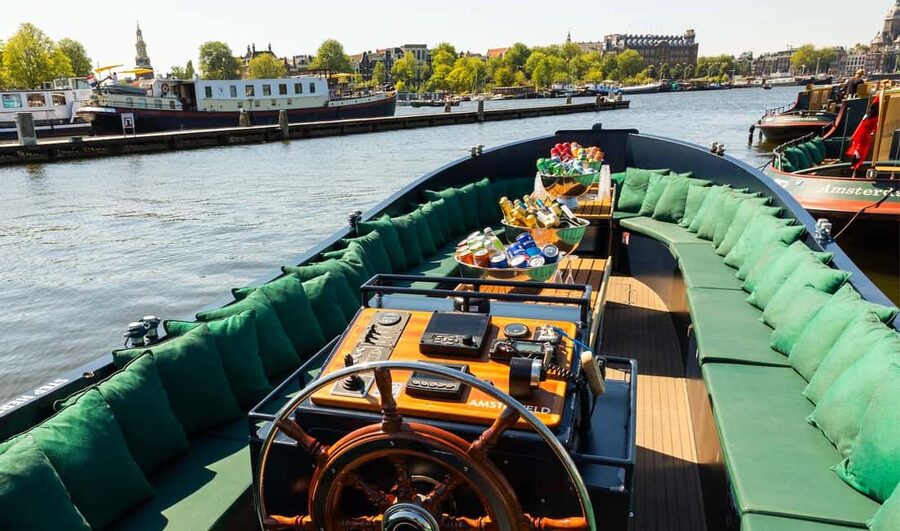 Amsterdam: Guided Open Boat Canal Cruise Including Drink - Who should book this cruise?