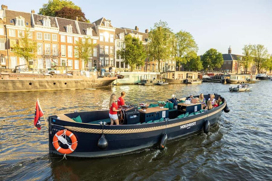 Amsterdam: Guided Open Boat Canal Cruise Including Drink - From the Jewish Cultural District to the Amstel