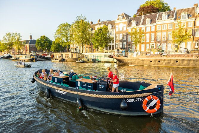 Amsterdam: Guided Open Boat Canal Cruise Unlimited Drinks Option - The canal belt and the Seven Bridges view
