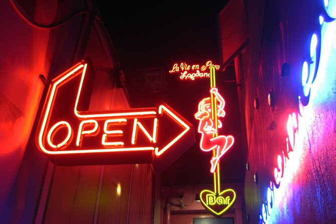 Amsterdam: Guided Red Light District and City Walking Tour - Reading the Red Light District beyond the windows