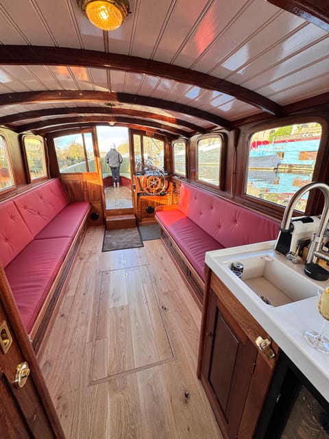 Amsterdam: Historic Boat Cruise with open bar and nibbles - Indoor or outdoor seating in Dutch weather