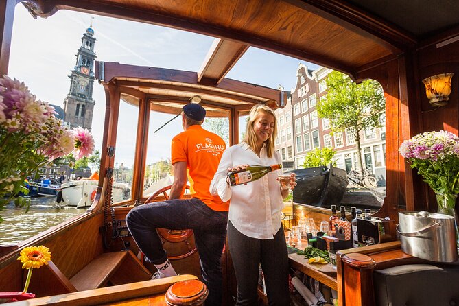 Amsterdam Historic Tour On Classic Saloon Boat - Drinks, cheese, blankets, and the practical tradeoffs
