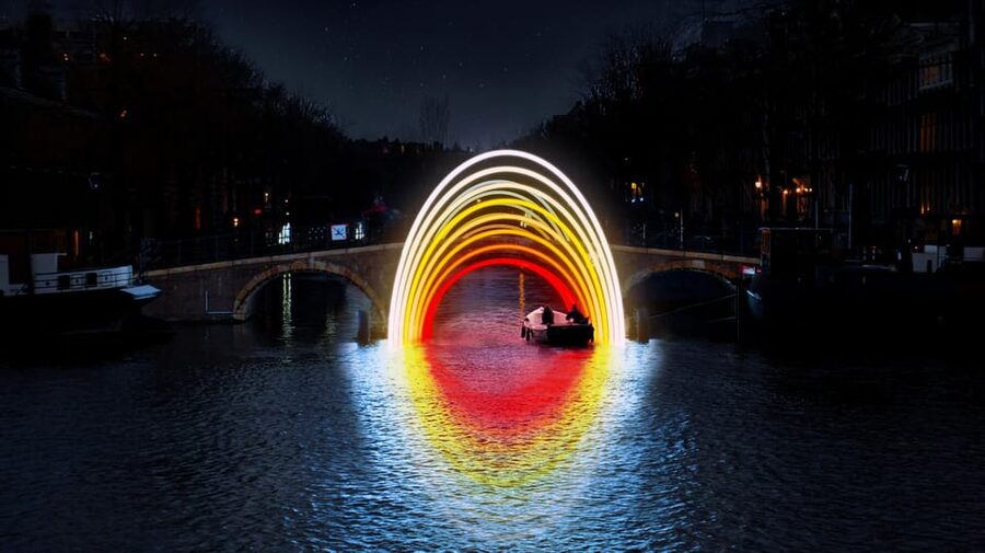 Amsterdam: Light Festival Boat Tour with Warm Drinks - Amsterdam canals become the gallery