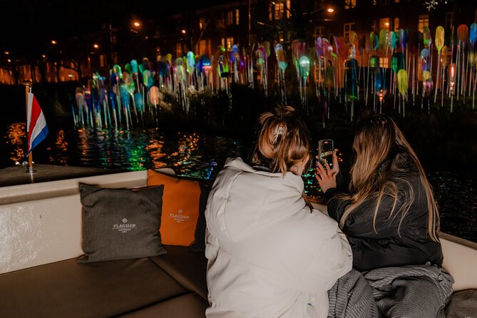 Amsterdam Light Festival: Canal Cruise + Bite & Unlimited Drinks - Seeing Amsterdam’s lights from the canal