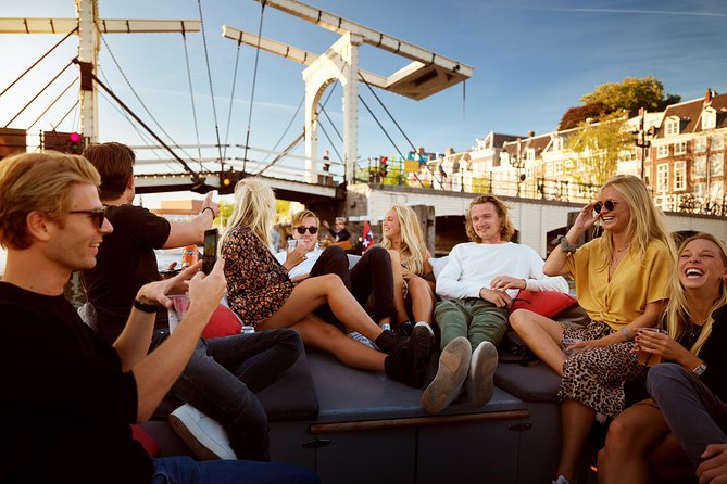 Amsterdam Light Festival: Saloon Boat Cruise + Hot Drinks & Bite - Seeing Amsterdam’s lights from the water