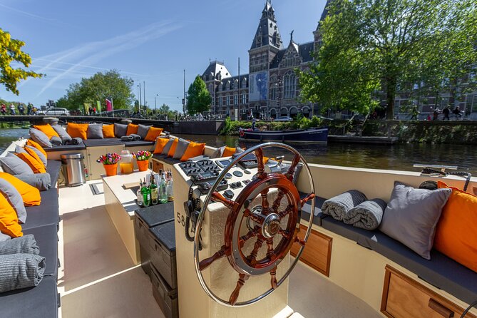 Amsterdam Light Festival: Saloon Boat Cruise + Hot Drinks & Bite - What the 75-minute route feels like