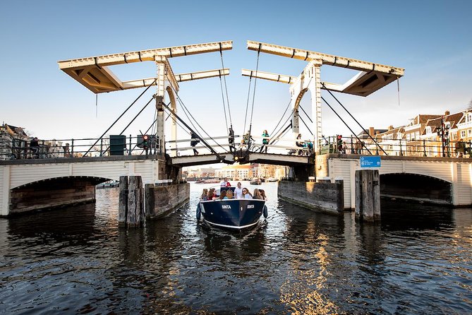 Amsterdam Open Boat Cruise in Old City Center with Live Guide - Seeing Amsterdam from an open electric boat