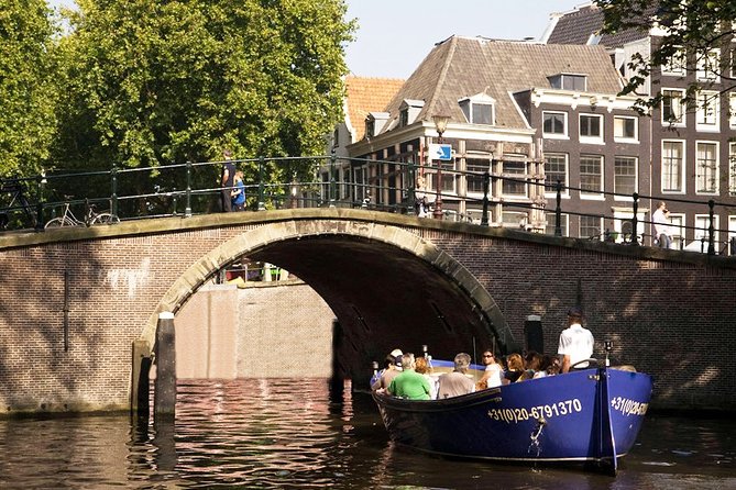 Amsterdam Open Boat Sightseeing Canal Cruise - The Amstel Hotel and the river setting