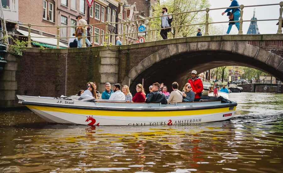 Amsterdam: Open Boat Tour of Canals with Expert Local Guide - Outdoor seating, blankets, and the weather question