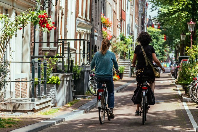 Amsterdam PRIVATE Bike Tour With Locals: Bike & Local Snack Included - Magere Brug and the Amstel