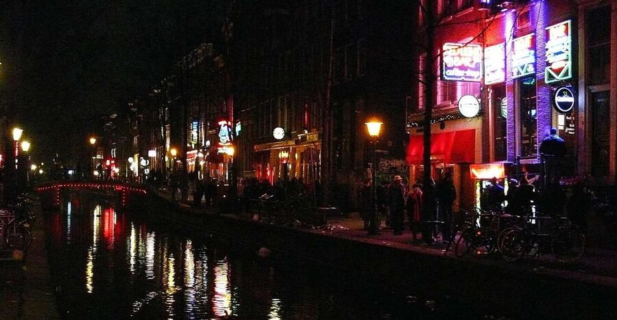 Amsterdam: Red Light District and Coffeeshop tour - The old city beneath the neon
