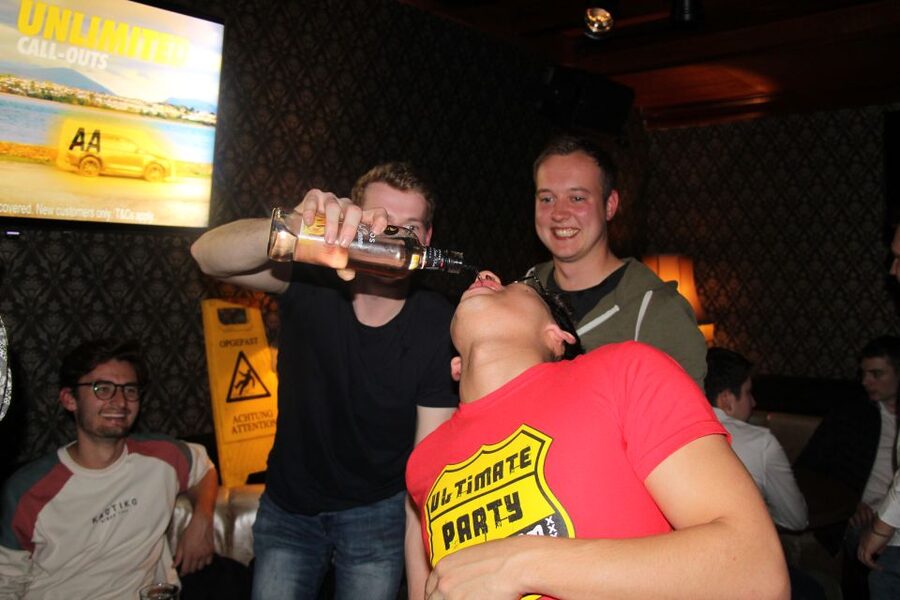Amsterdam: Red-Light District Pub Crawl and Booze Boat Tour - Entering a nightclub at the end