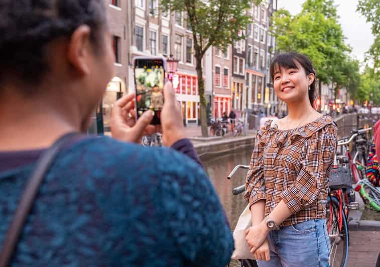 Amsterdam: Red Light Tour Exclusive + Peep Show - Condoms, the Oude Kerk, and the district’s older layers