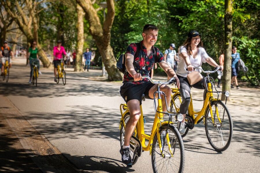 Amsterdam: Relaxed City Highlights Guided Bike Tour - Museumplein, luxury shopping, and the Skinny Bridge