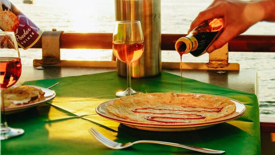 Amsterdam: River Cruise With All-You-Can-Eat Dutch Pancakes - Taking the free ferry to the pancake boat