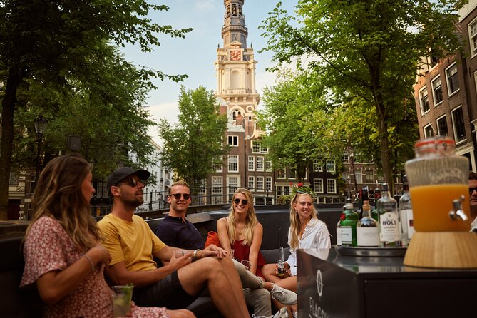 Amsterdam: Saloon Boat Cruise + Unlimited Drinks & Bite option - Following the Amstel, the river that gave the city its name