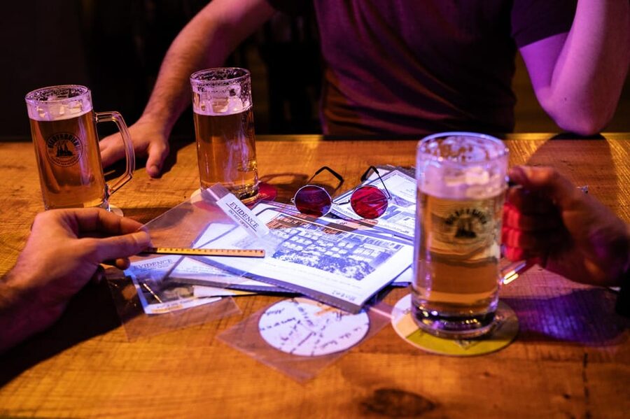 Amsterdam: Self-guided Red Light District Pub Crawl Mystery - Walking through Amsterdam’s famous district