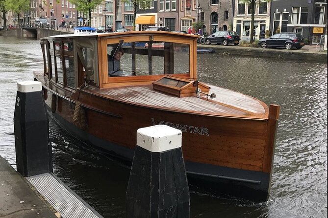 Amsterdam small-group canal cruise in 1920s saloon boat - Reguliersgracht and Magere Brug bring variety