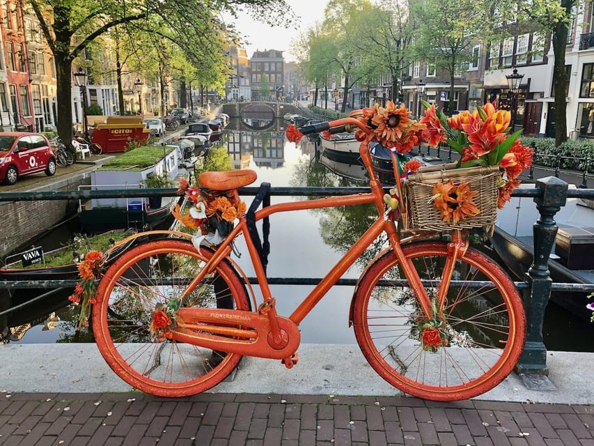 Amsterdam: Small Group Walking Tour with Fun Guide - Canals, canal houses, and the city’s best visual clues