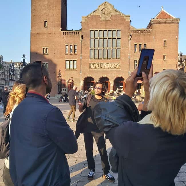Amsterdam: Spanish Tour Unmasking the Redlight District - Starting beside St. Nicholas Basilica