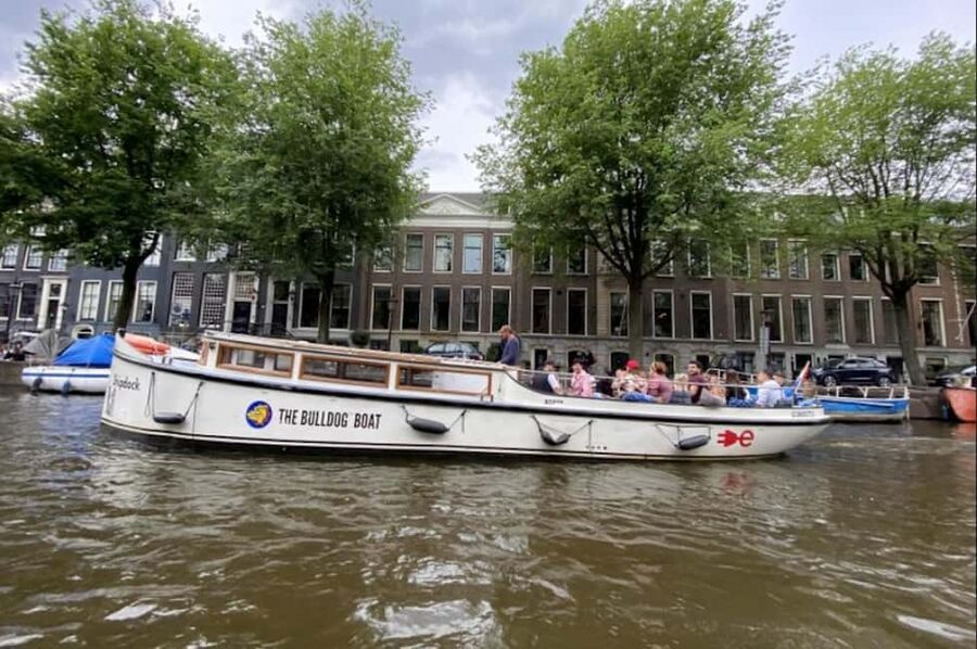 Amsterdam: The Bulldog Boat Smoke and Booze Cruise - Leaving the dock and following the old city wall