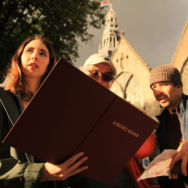 Amsterdam: Treasure Hunt Walking Tour "A Secret Sender" - Torensluis Bridge and the value of looking up