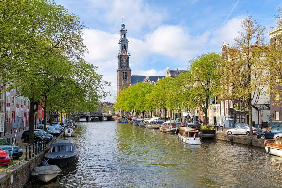 Amsterdam Walking Tour and Canal Cruise - Dam Square brings together royal and national symbols